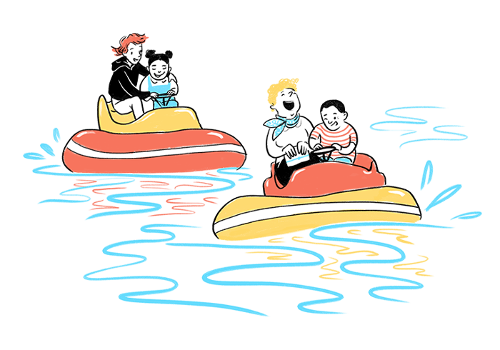 Children and adults sail on boats at the Reykjavík Family Park and Zoo