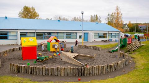A sandbox and playground equipment on the Jöklaborg grounds.